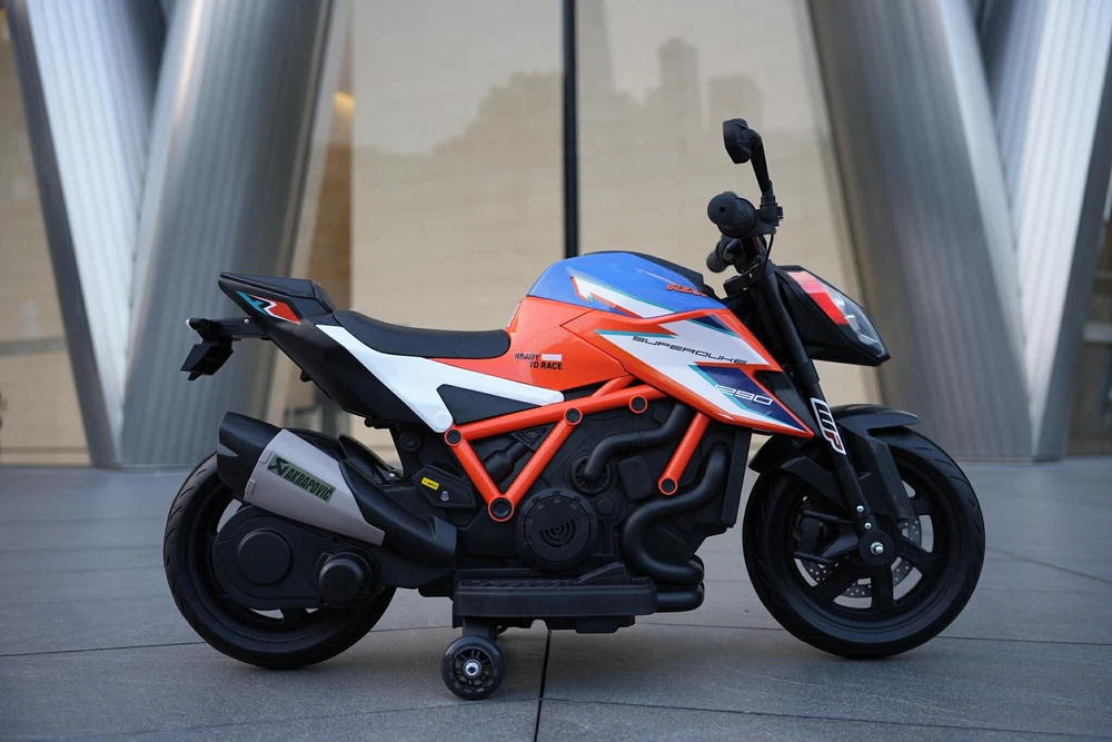 אופנוע סופרמוטו חשמלי לילדים - KTM - קיי.טי.אם דיוק 1290 12V